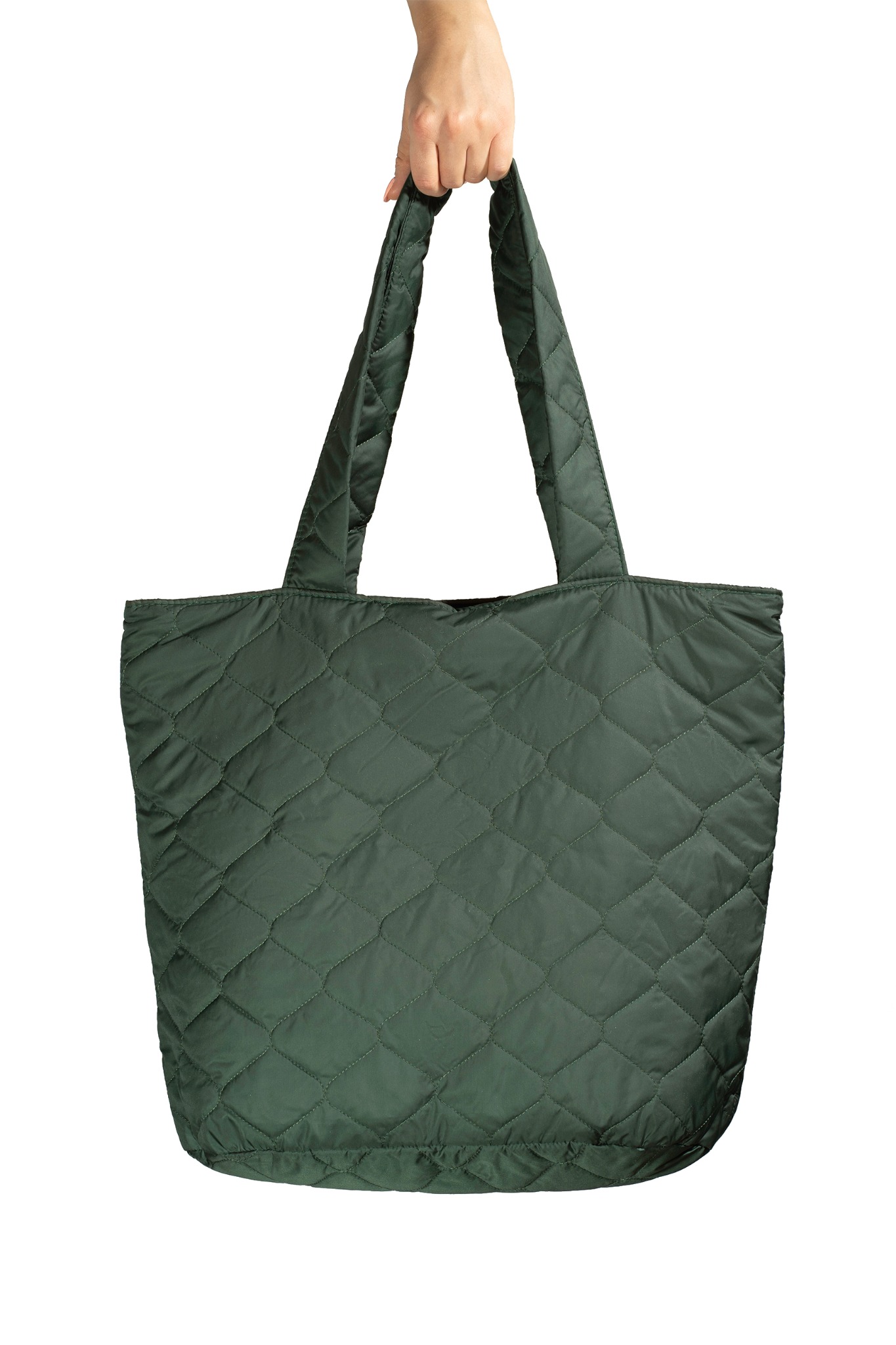 Pikowana, oliwkowozielona torba shopper z uchwytami, trzymana w dłoni na białym tle.