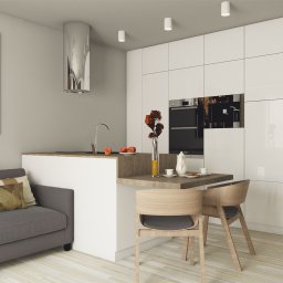 Projekt mieszkania dla czteroosobowej rodziny. Jasna kolorystyka oraz drewniane elementy, ocieplające wnętrze. Zabudowana kuchnia połączona z pokojem dziennym.
