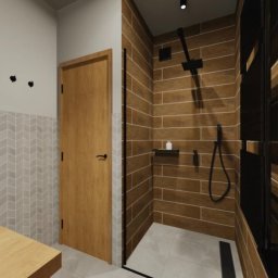 KOLORY i TEKSTURY Magdalena Myszk - Wizualizacja łazienki z drewnopodobnymi płytkami w kabinie prysznicowej, czarna armatura i drzwi prysznicowe, umywalka z drewnianym blatem, ściana wyłożona płytkami w jodełkę.