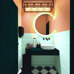 KOLORY i TEKSTURY Magdalena Myszk - Wizualizacja nowoczesnej łazienki z okrągłym lustrem podświetlonym LED, czarną armaturą, umywalką nablatową i geometryczną podłogą w biało-czarną szachownicę.