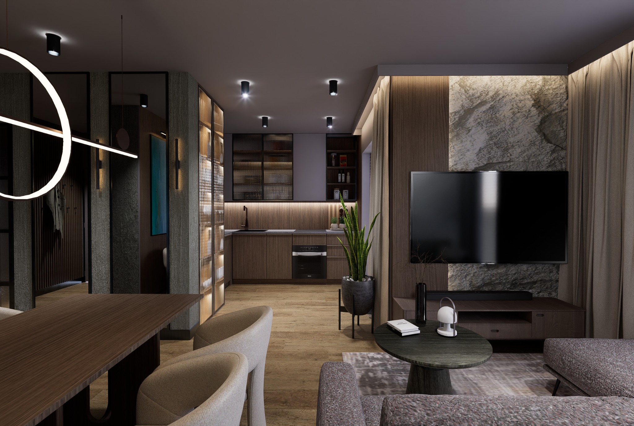 Nowoczesne wnętrze: salon z aneksem kuchennym, drewniane meble, kamienna ściana pod TV, okrągła lampa sufitowa. Ciepłe oświetlenie tworzy przytulną atmosferę.