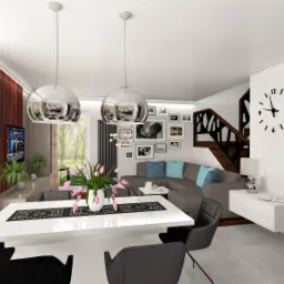 Wizualizacja salonu z jadalnią w nowoczesnym stylu: biały stół z czarnymi krzesłami, szara sofa z niebieskimi poduszkami, schody z ażurową balustradą i dekoracyjna galeria zdjęć na ścianie.