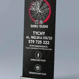 Roll-up reklamowy z logo i danymi kontaktowymi restauracji sushi Shiki Sushi z Tychów, z motywem kwitnącej wiśni w czerwonym okręgu.