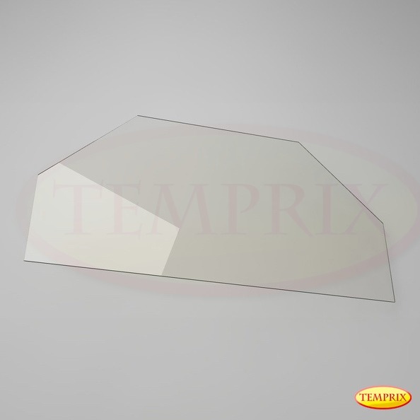 Nieregularny szklany element o trapezoidalnym kształcie z ściętymi rogami, leżący na jasnoszarym tle, z widocznymi refleksami światła.