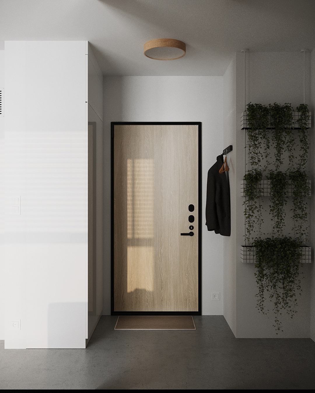 Minimalistyczny przedpokój z drewnianymi drzwiami wejściowymi w czarnej ramie, wieszakiem z czarnym płaszczem i wiszącymi roślinami w metalowych koszach.