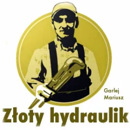 Grafika przedstawiająca hydraulika z kluczem francuskim na tle złotego koła, z napisem 'Złoty hydraulik' i imieniem 'Garlej Mariusz'.