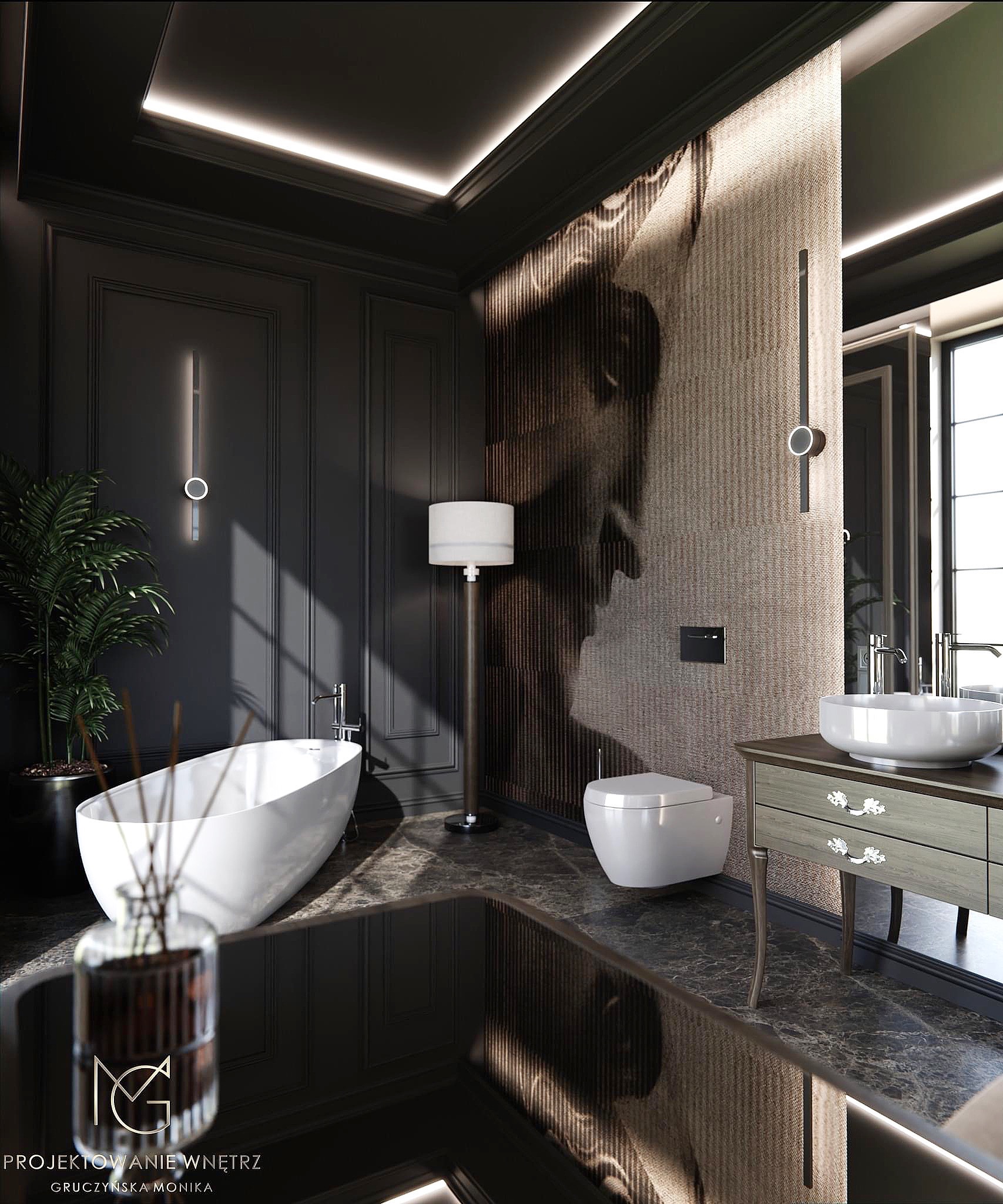 Elegancka łazienka w ciemnej tonacji z wolnostojącą wanną, toaletą podwieszaną i umywalką nablatową na szafce z dekoracyjnymi uchwytami, oświetlona lampą podłogową i listwami LED oraz ozdobiona...