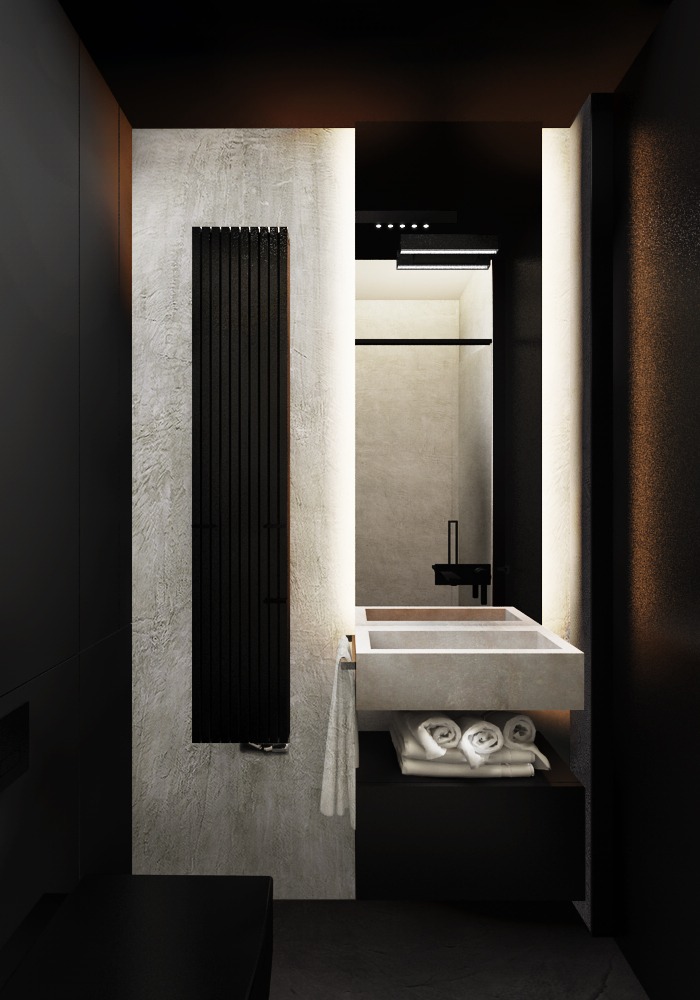 Minimalistyczna łazienka w czerni i bieli z podświetlanym lustrem nad podwójną umywalką z betonu architektonicznego i czarnym grzejnikiem drabinkowym na teksturowanej ścianie.