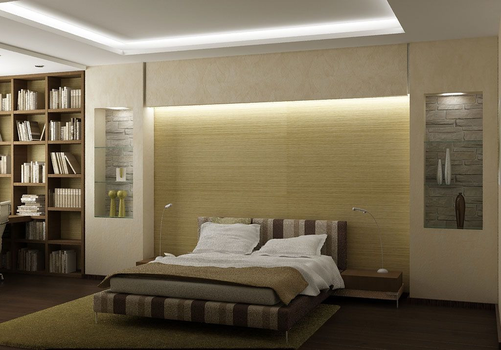 Nowoczesna sypialnia z podświetlaną ścianą za łóżkiem, wnęki dekoracyjne z kamieniem i oświetleniem punktowym, regał z książkami po lewej stronie.
