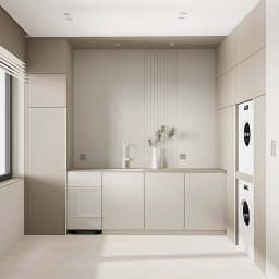 OM Dekor Sylwia Kaczmarek-Bartoszek - Beżowa pralnia w Sierosławiu: minimalistyczne szafki, pralka w zabudowie, okno z żaluzjami i dekoracyjna waza z gałązkami na blacie. Stonowana kolorystyka.