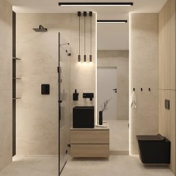 OM Dekor Sylwia Kaczmarek-Bartoszek - Nowoczesna łazienka z kabiną typu walk-in, czarną armaturą i umywalką na drewnianej szafce. Minimalistyczne oświetlenie podkreśla jasne płytki i naturalne drewno.