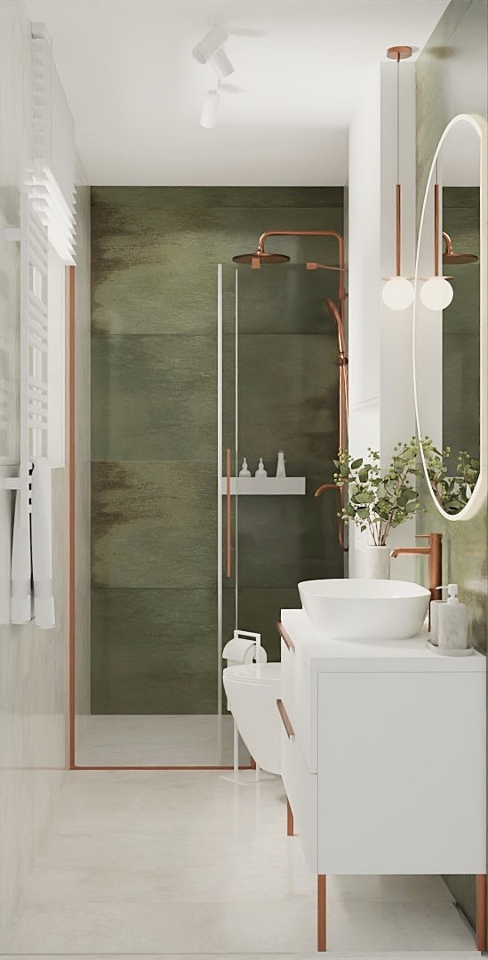 Nowoczesna łazienka z zielonymi płytkami i miedzianymi akcentami: kabina prysznicowa, umywalka nablatowa, lustro z oświetleniem. Minimalistyczny design, jasne wnętrze.