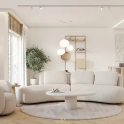 Jasny salon z okrągłym dywanem, beżową sofą modułową, kulistymi lampami i drewnianymi żaluzjami, akcentowany rośliną w doniczce i dekoracjami na stoliku kawowym.