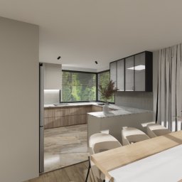 OLIV - Design projektowanie wnętrz Justyna Leszczyńska - Wnętrze jasnej kuchni z oknem na zieleń, marmurowy blat, drewniane szafki i stół z kwiatami. Nowoczesny design z elementami naturalnymi.