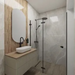 Nowoczesna łazienka z owalnym lustrem, drewnianymi akcentami i marmurowymi ścianami. Minimalistyczny design z czarną armaturą i drewnianą podłogą.