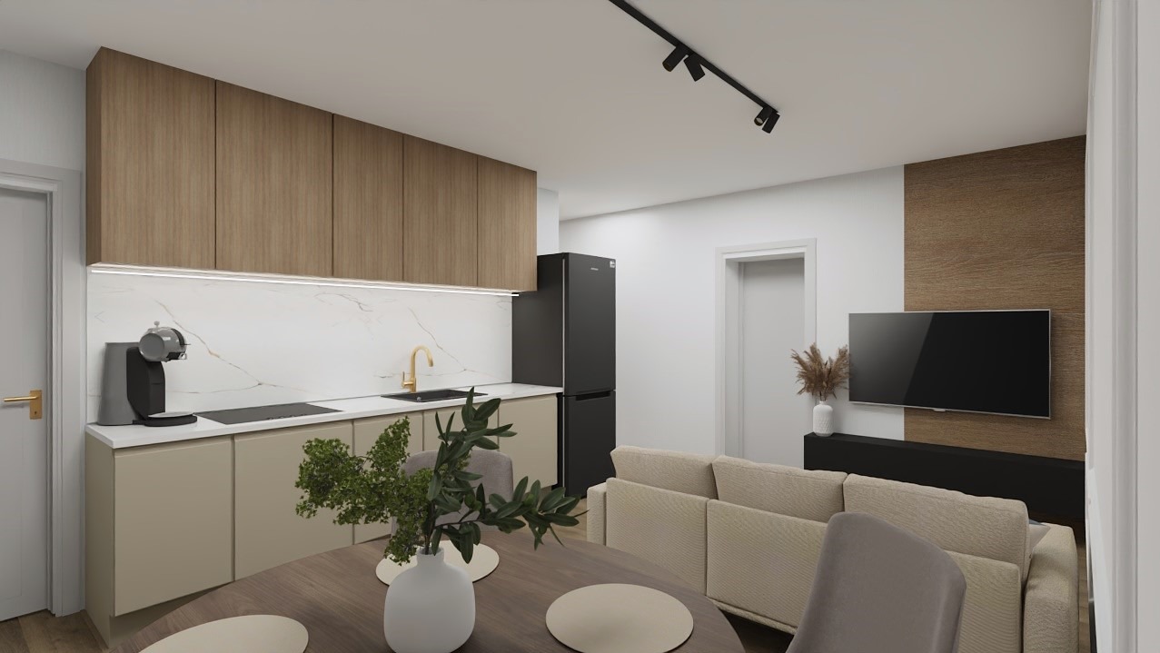 Wnętrze mieszkania z aneksem kuchennym: drewniane szafki, marmurowy backsplash, czarna lodówka, sofa w odcieniach beżu i okrągły drewniany stół z dekoracją.