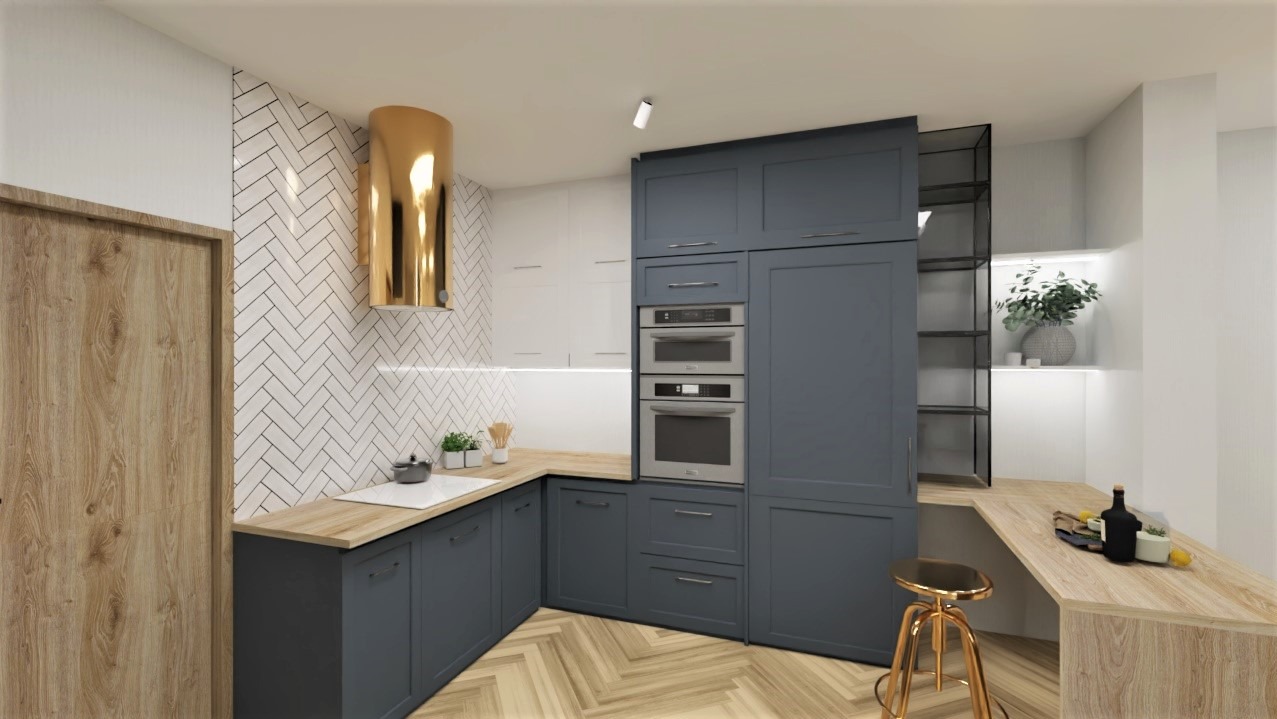 Wnętrze kuchni z szarymi szafkami, złotym okapem i drewnianymi blatami. Na blacie butelka wina. Podłoga w jodełkę. Ściana z białych płytek.