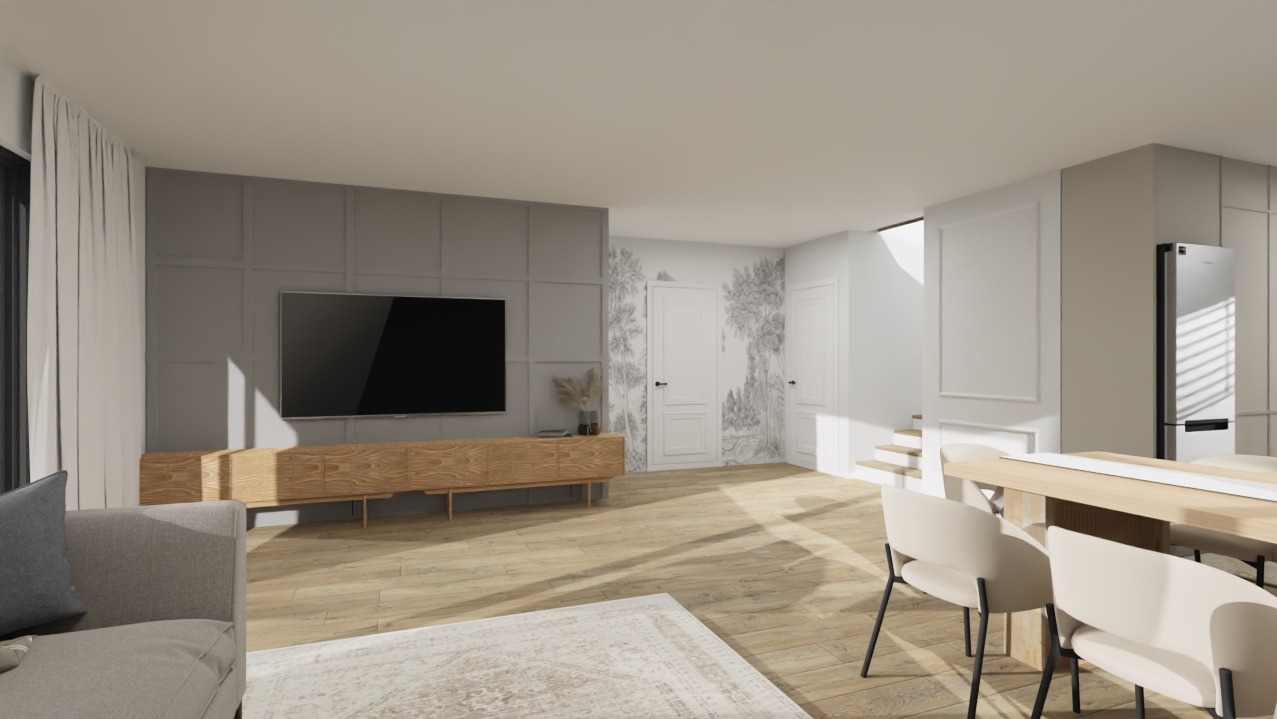 Jasne, przestronne wnętrze: salon z szarą sofą, drewnianą szafką RTV i telewizorem, przechodzący w jadalnię z beżowymi krzesłami i drewnianym stołem. Minimalistyczny design.