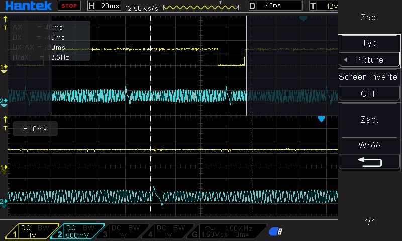 Ekran oscyloskopu Hantek z widocznymi przebiegami sygnałów elektrycznych, ustawienia pomiarowe napięcia i czasu wyświetlane na ekranie.