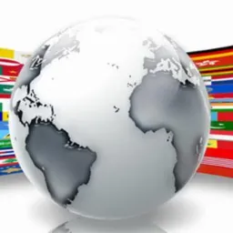 Stylizowana kula ziemska w odcieniach szarości na tle flag różnych państw, symbolizująca globalny zasięg usług.