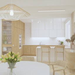 Mikab Studio. Projektowanie Wnętrz. Magdalena Mizia - Wizualizacja wnętrza: jadalnia z okrągłym stołem i bukietem tulipanów, otwarta na kuchnię z wyspą i drewnianymi szafkami oraz schody z białymi balustradami, całość w jasnej, neutralnej kolorystyce.