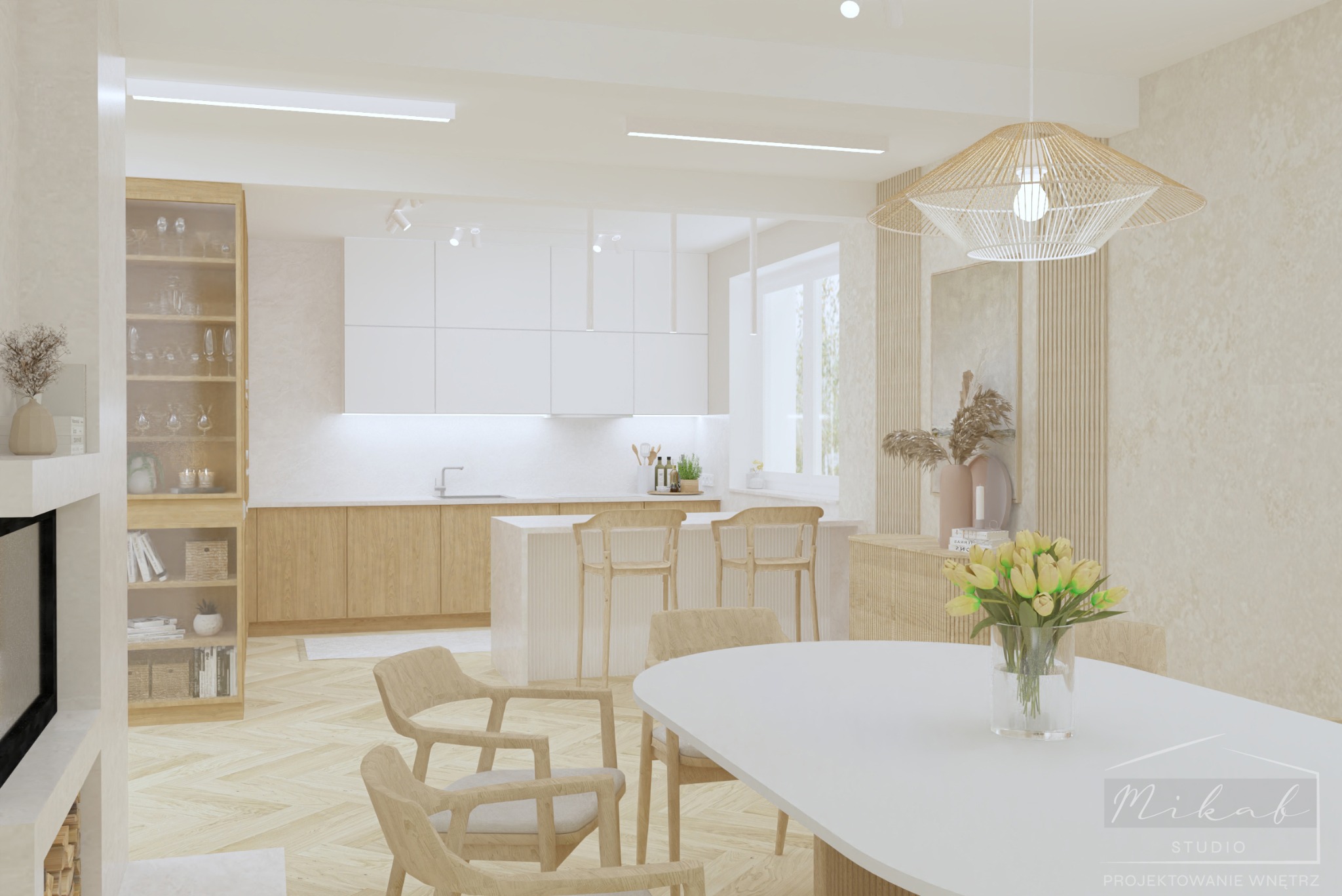 Jasne, przestronne wnętrze kuchni z jadalnią w Dąbrowie Górniczej, z drewnianymi akcentami, białymi meblami i parkietem w jodełkę. Na pierwszym planie okrągły stół z bukietem żółtych tulipanów.