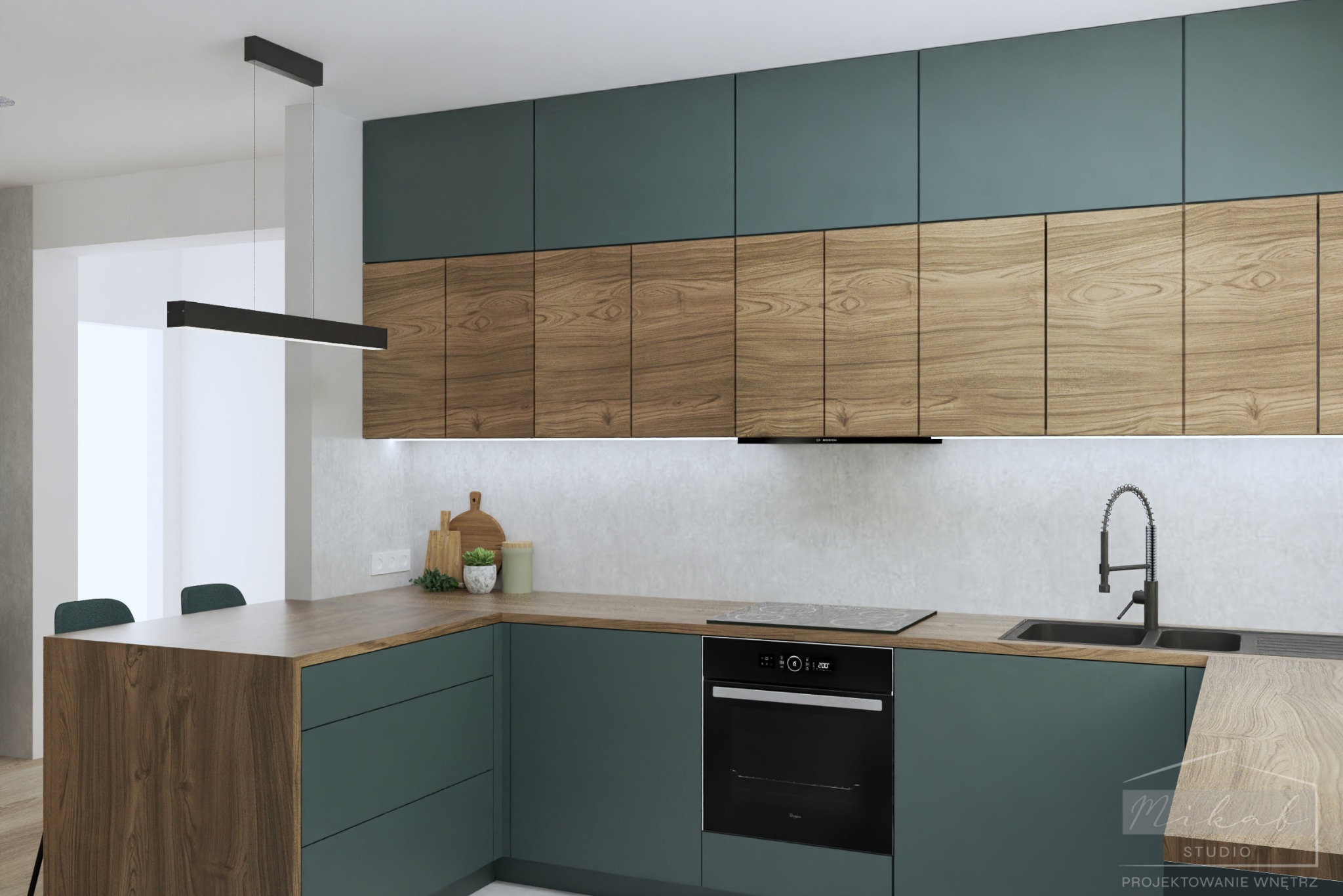 Nowoczesna kuchnia z zielonymi szafkami dolnymi i drewnopodobnymi górnymi, czarny piekarnik i płyta indukcyjna, minimalistyczna lampa wisząca.