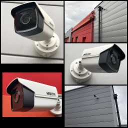 Kamera CCTV marki HQ System zamontowana na elewacji budynku o szarych i czerwonych panelach, widoczna z różnych perspektyw.