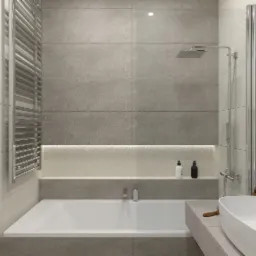 Minimalistyczna łazienka w Gliwicach z wanną, umywalką nablatową i szarymi płytkami, oświetlona listwą LED w półce.