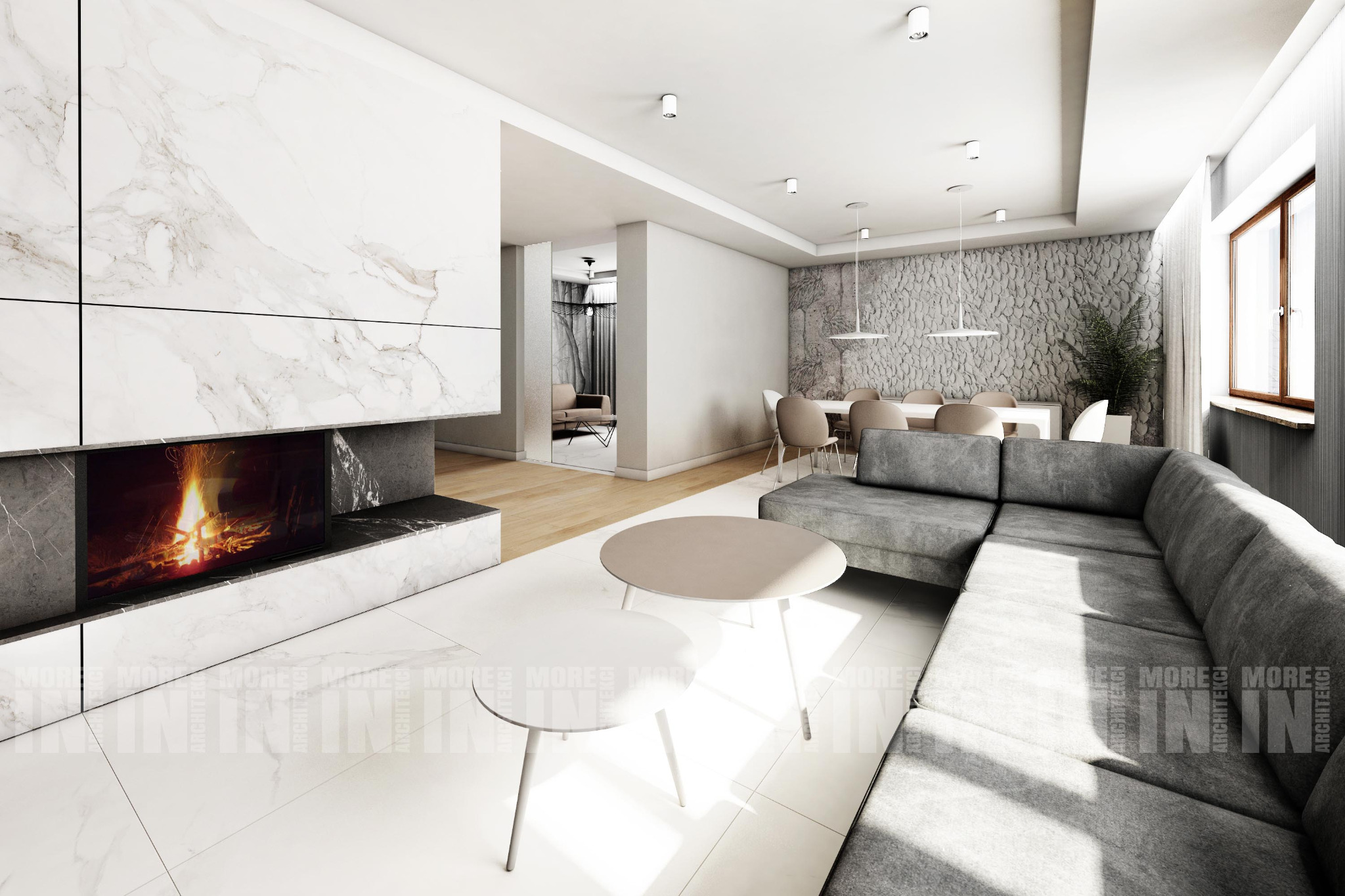 Wnętrze nowoczesnego salonu z marmurowym kominkiem, szarą sofą narożną i okrągłymi stolikami kawowymi, widok na jadalnię i dalszą część mieszkania.