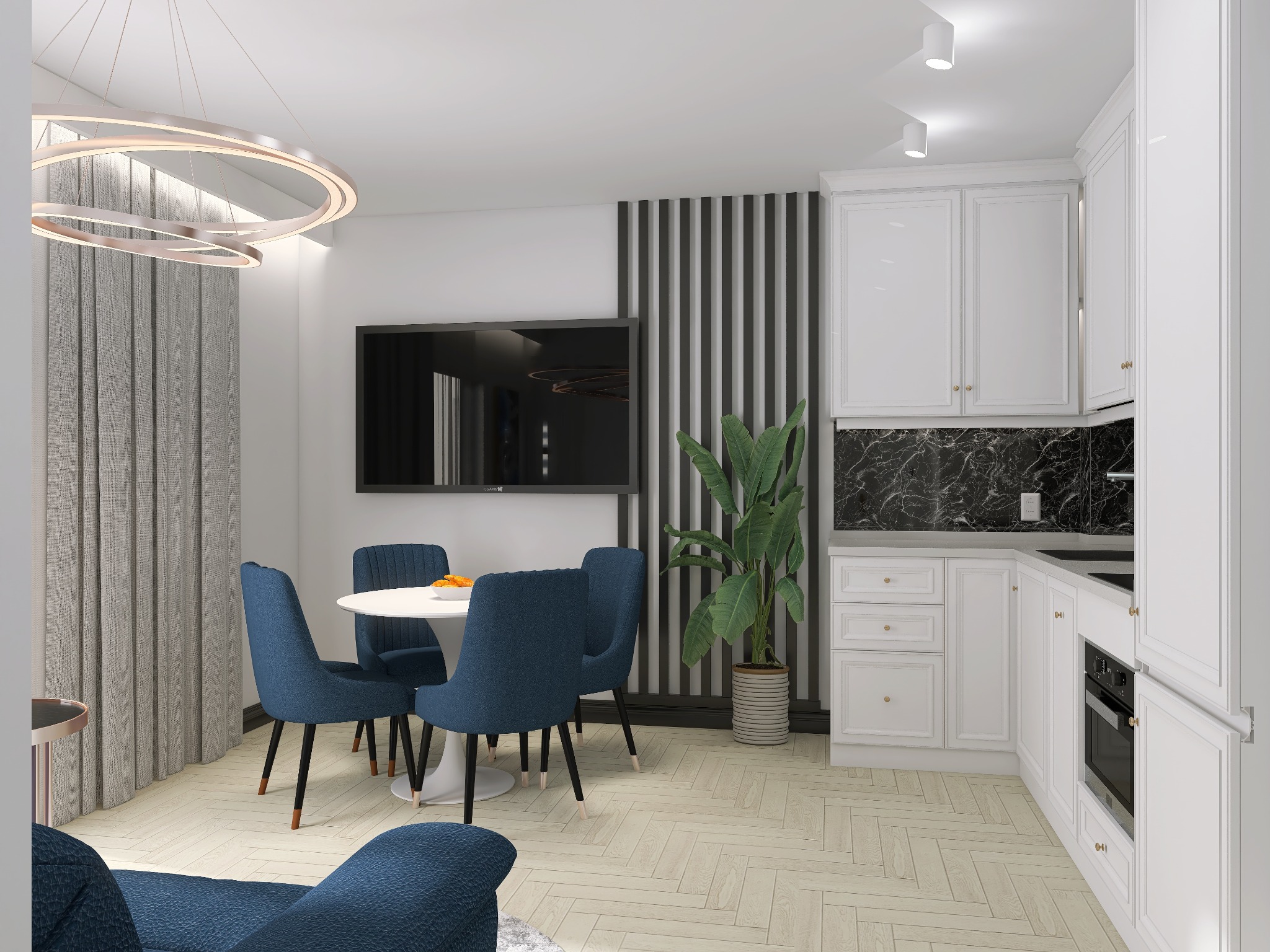 Jasne wnętrze z okrągłym stołem, niebieskimi krzesłami, minimalistyczną lampą i białą zabudową kuchenną z marmurowym blatem.