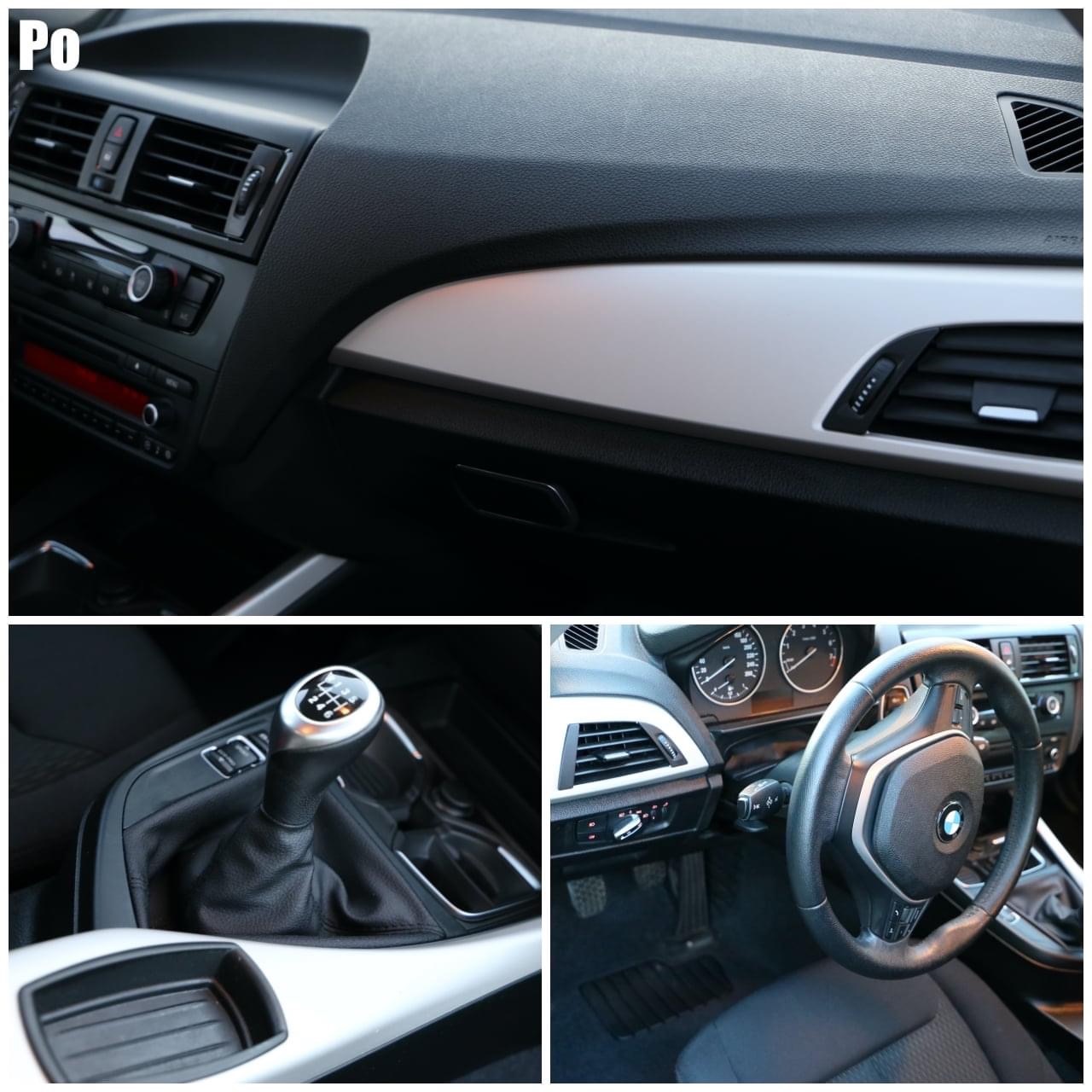 Wnętrze samochodu marki BMW, widok na deskę rozdzielczą, kierownicę oraz dźwignię zmiany biegów, z elementami wykończenia w kolorze srebrnym.