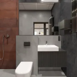 Nowoczesna łazienka z umywalką na szafce z ryflowanymi frontami, wiszącą toaletą i dużym lustrem z podświetleniem LED, utrzymana w szarościach z akcentem rdzawej ściany.