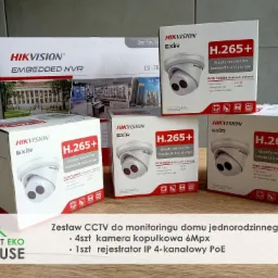 Zestaw kamer kopułkowych i rejestratora IP firmy Hikvision w pudełkach, przeznaczony do monitoringu domu jednorodzinnego, widoczny logotyp Smart Eko House.