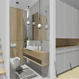 Nowoczesna łazienka z drewnianymi akcentami: szafka pod umywalką, lustro z wiszącymi lampami, toaleta i szara szafa w zabudowie. Minimalistyczny design.