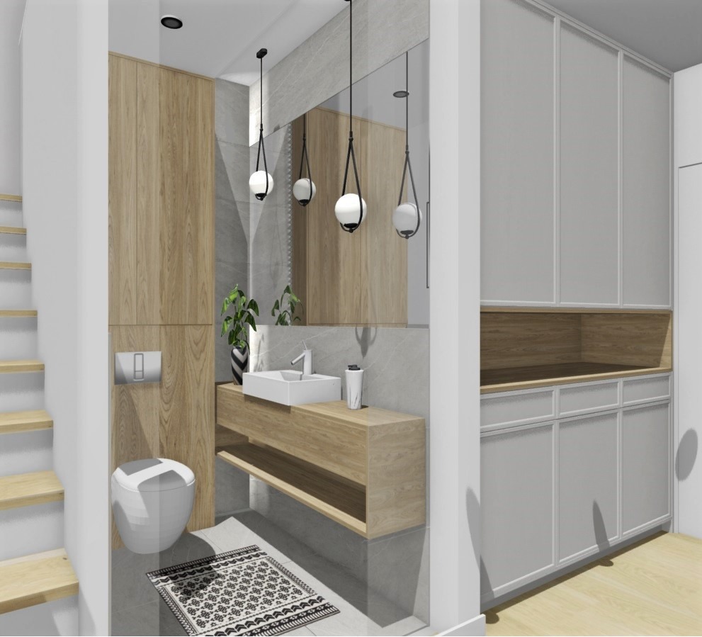 Nowoczesna łazienka z drewnianymi akcentami: szafka pod umywalką, lustro z wiszącymi lampami, toaleta i szara szafa w zabudowie. Minimalistyczny design.