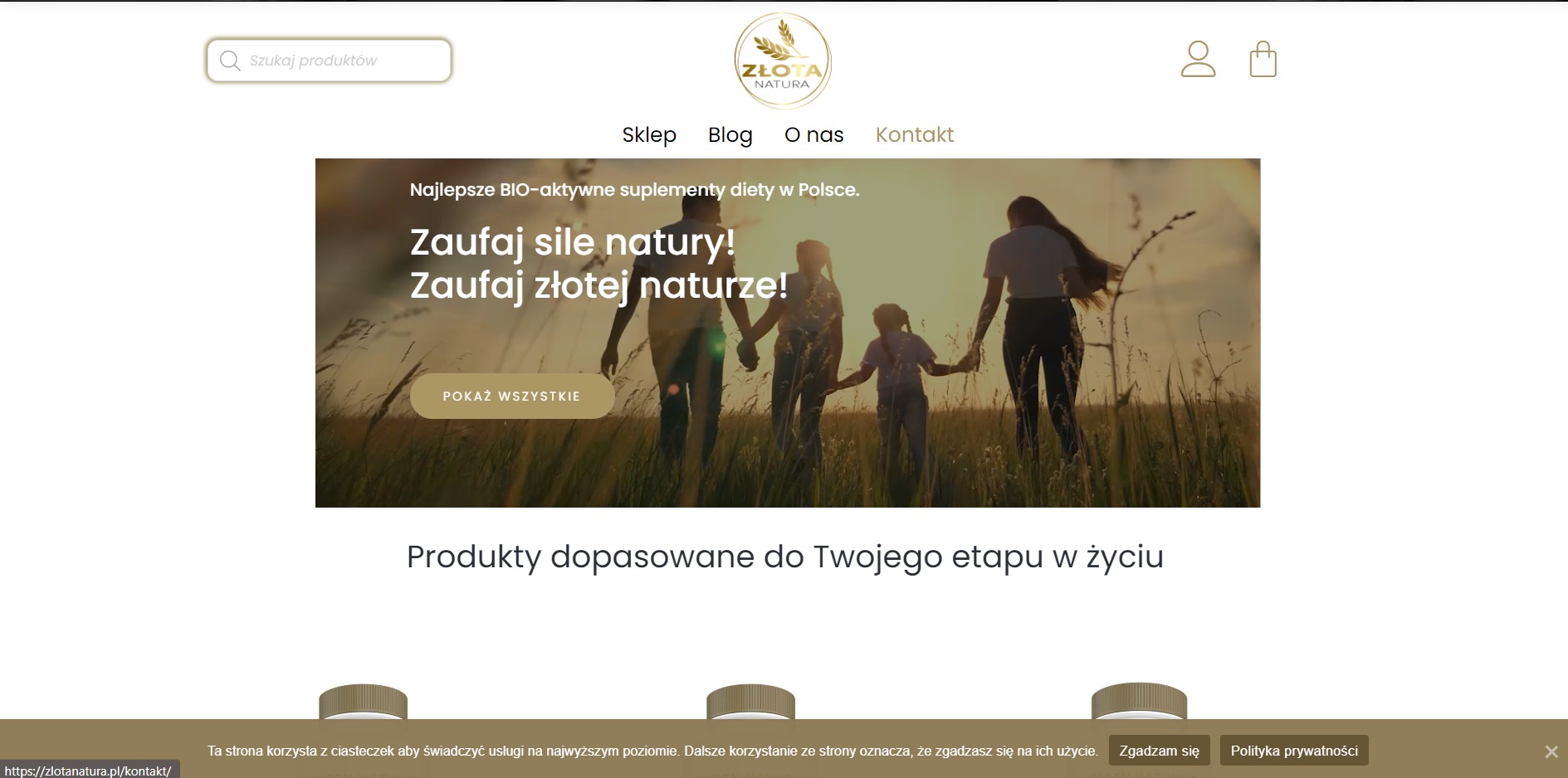 Strona główna sklepu internetowego z suplementami diety, z hasłem 'Zaufaj sile natury! Zaufaj złotej naturze!', w tle sylwetki rodziny na tle zachodzącego słońca.