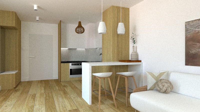 Wnętrze mieszkania z drewnianą podłogą, białą sofą z dekoracyjną poduszką i stołkiem barowym przy białym blacie, w tle zabudowa kuchenna z drewnianymi i białymi frontami oraz wiszącymi lampami.
