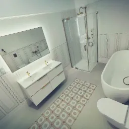 Wykończona łazienka w stylu klasycznym z białą armaturą, kabiną prysznicową ze złotymi detalami, podświetlanym lustrem nad umywalką, ozdobną listwą na ścianach i wzorzystym dywanikiem.