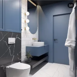 Nowoczesna łazienka w odcieniach błękitu i szarości z marmurowymi akcentami, okrągłym lustrem i złotą armaturą.