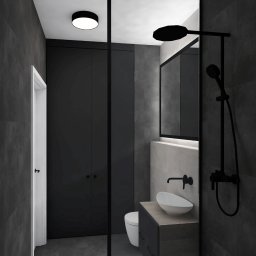 Mieszkanie na najem długoterminowy. Widok na łazienkę.
Główną wytyczną projektu, było stworzenie przestrzeni loftowej, z wykorzystaniem betonu architektonicznego, drewna i kontrastowej czerni. 