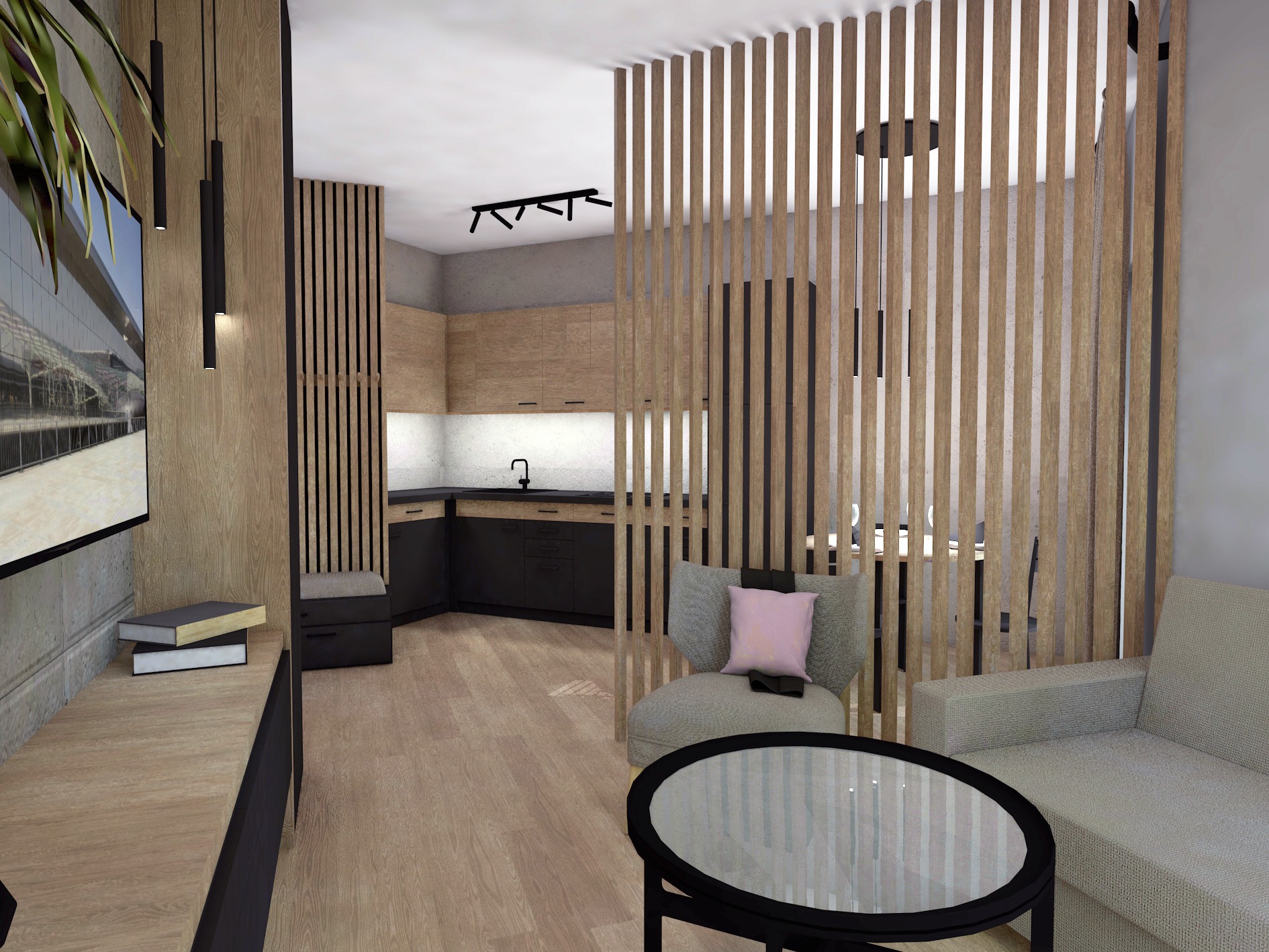 Wnętrze mieszkania z subtelnym podziałem strefy wypoczynkowej i kuchni za pomocą drewnianych lameli. Widoczny szary fotel z różową poduszką, okrągły stolik kawowy z szklanym blatem oraz fragment...