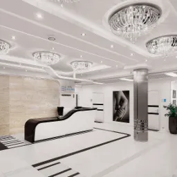 Eleganckie wnętrze szpitala z recepcją w odcieniach bieli i czerni, ozdobione kryształowymi żyrandolami i nowoczesnym oświetleniem, z widocznym logo 'Szpital na Klinach' na ekranie...