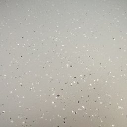 RAMI FLOOR RAFAŁ KLOCEK, MICHAŁ GORCZYCA SPÓŁKA CYWILNA - Jasnoszara posadzka żywiczna z drobnymi, czarnymi i białymi elementami dekoracyjnymi, tworzącymi wzór terrazzo. Gładka powierzchnia, równomierne rozłożenie wzoru.