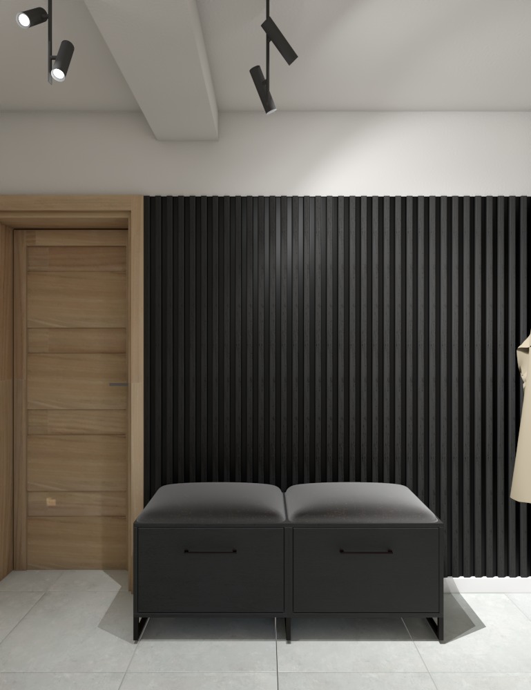 Nowoczesny przedpokój z drewnianymi lamelami na ścianie, szarą pufą z dwoma siedziskami i minimalistycznym oświetleniem punktowym.