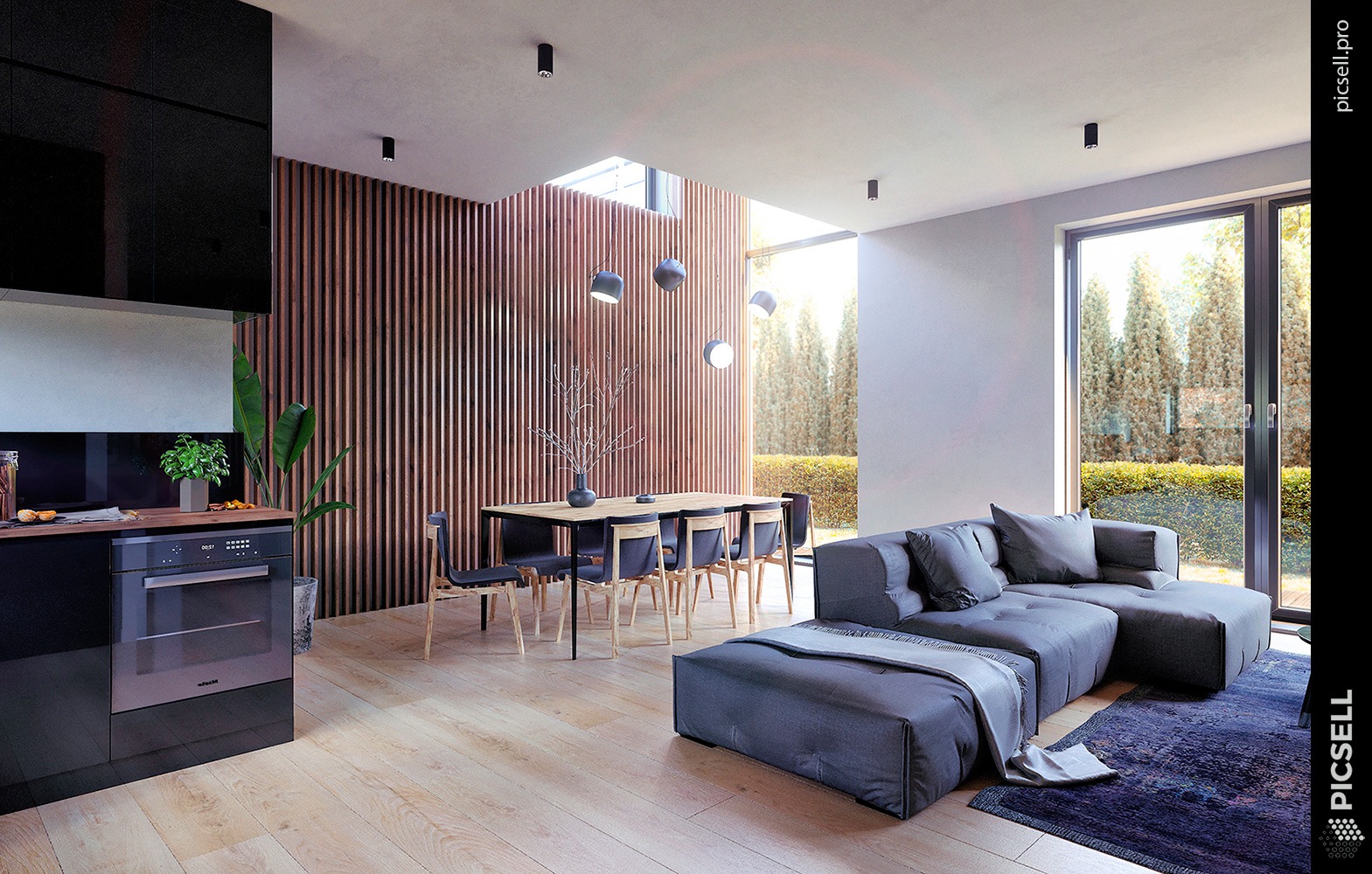 Nowoczesne wnętrze: czarna zabudowa kuchenna z piekarnikiem Miele, stół z krzesłami, szara sofa modułowa na tle okna z widokiem na ogród, drewniane lamele na ścianie.