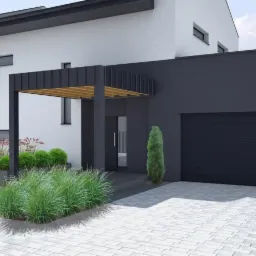 Nowoczesny ogród przed domem z minimalistyczną pergolą, ozdobnymi trawami i kulistymi krzewami, wyłożony jasnoszarą kostką brukową.