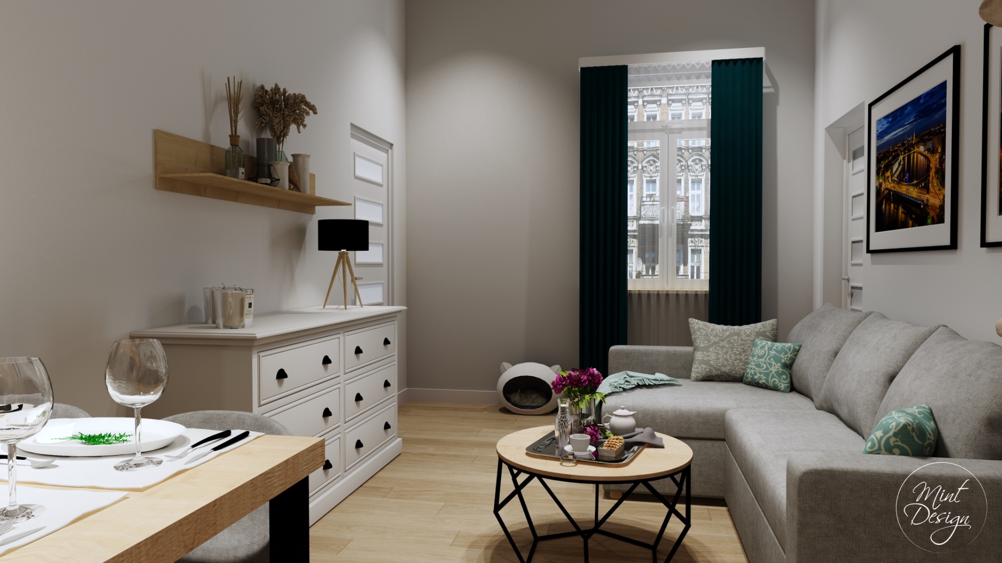 Jasne wnętrze salonu z jadalnią: szara sofa narożna z dekoracyjnymi poduszkami, okrągły stolik kawowy z kwiatami i zastawą, biała komoda, drewniana półka z dekoracjami, stół jadalny z nakryciem...