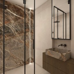 Paulina Teodorczyk - Architektura Wnętrz - Nowoczesna łazienka z kabiną prysznicową typu walk-in, marmurową ścianą i umywalką nablatową z tego samego materiału. Minimalistyczne czarne ramy i armatura.