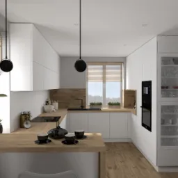 Nowoczesna kuchnia z białymi szafkami, drewnianym blatem i akcentami roślinnymi, czarne filiżanki na blacie, czarna lodówka Samsung po prawej.